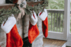 Holiday stockings on a mantle | Photo by Any Lane/Pexels