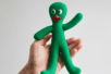 Hand holding Gumby doll