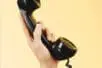 A hand holding a phone