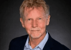 man in blue shirt and suit jacket