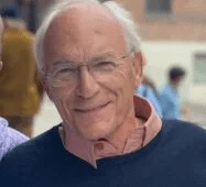 Man with glasses smiling