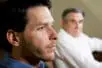 A man looks despondent as his father looks at him