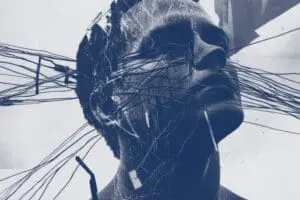Grey and white picture of man's head crisscrossed with strings.