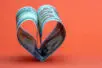 Two 100 dollar bills folded together to form a heart