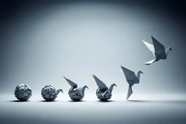 A series of illustrations show a crumpled ball of paper transform into a paper crane step by step