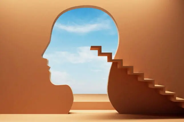 Illustration of a staircase climbing to the empty outline of a head