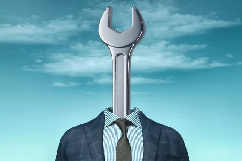 Image of a wrench wearing a business suit