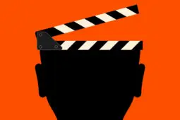 Image of a head of which the top is a director's slate about to snap shut