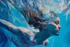 Illustration of a young woman's face as she submerges gently under the surface of water