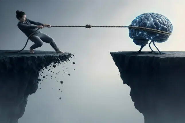 A woman stands on the edge of a cliff pulling a rope attached to a brain trying to escape