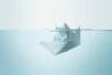 Illustration of a paper boat slowly sinking beneath water