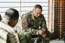 Military people in a group therapy session / Photo by RDNE Stock project/Pexels