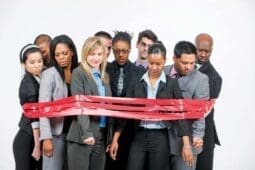 A group of people surrounded by red tape