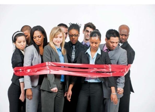 A group of people surrounded by red tape