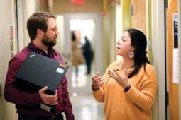 A man and woman talking emphatically