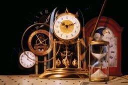 A bunch of clocks and an hourglass