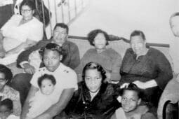 A black ad white photo of an African American family