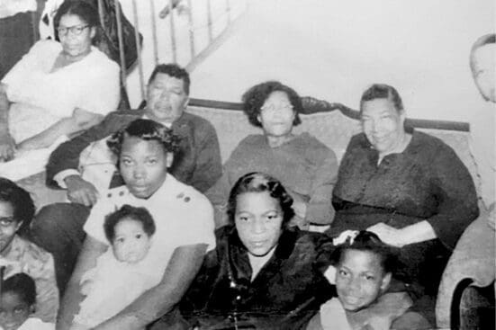 A black ad white photo of an African American family