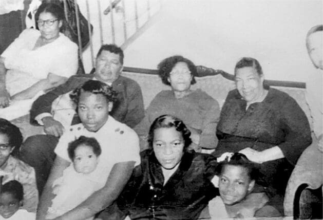 A black ad white photo of an African American family