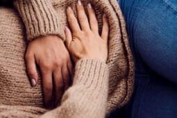 A woman holding her stomach