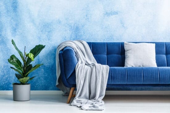 A couch with a blanket