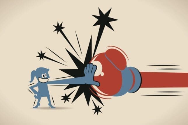 An illustration of a woman blocking a punch