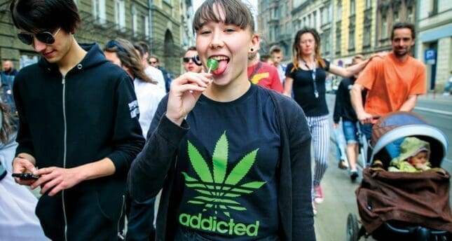 A woman with a pot leaf shirt