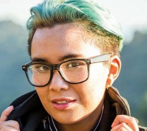 A young person with dyed hair