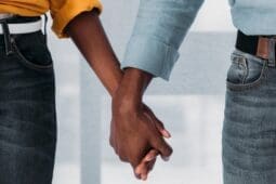 Two people holding hands