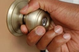 A hand on a doorknob