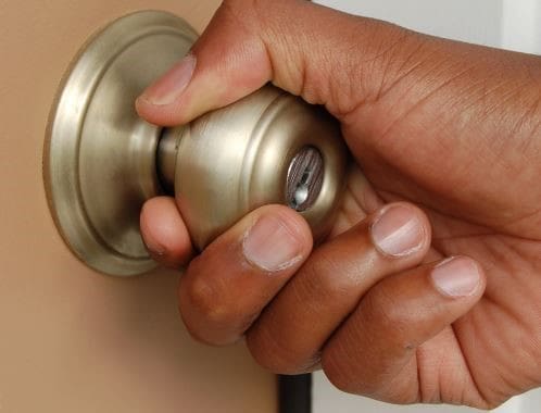 A hand on a doorknob