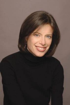 A headshot of a woman