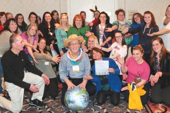 A group of people smile for the camera