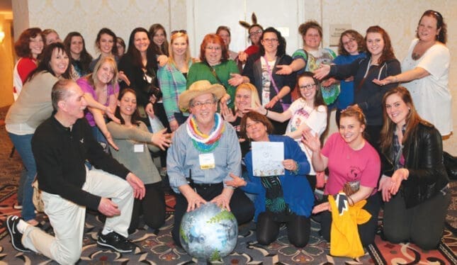 A group of people smile for the camera