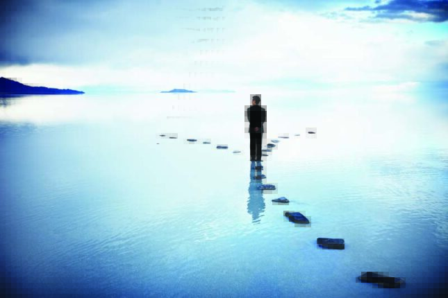 A figure walking on a path of stones through water and reaches as fork