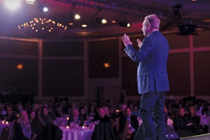 A man stands on stage