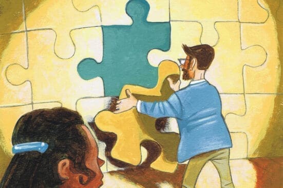 A woman watches as a man inserts the final piece of a large puzzle