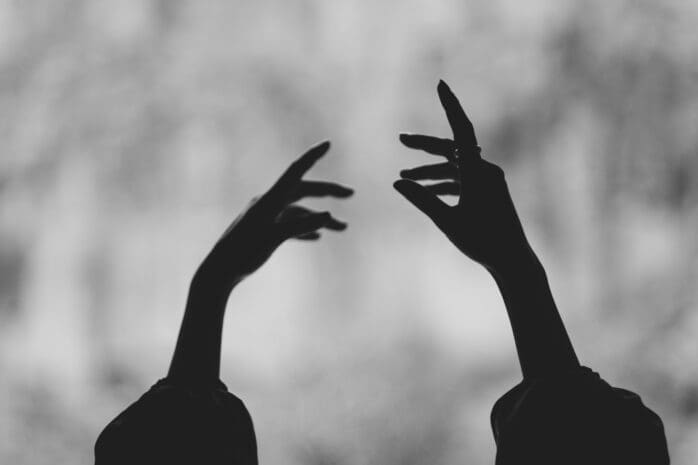 Hands in the air in a dance / Photo by Sadi Gökpınar