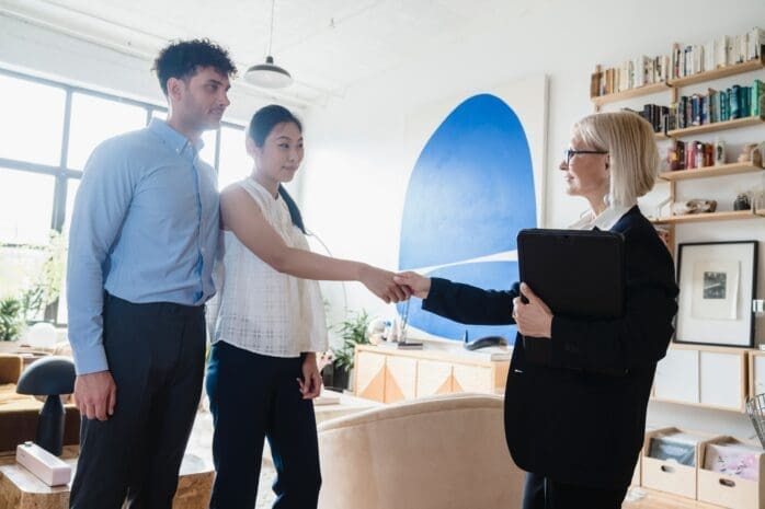 Therapist shaking hands with couple client