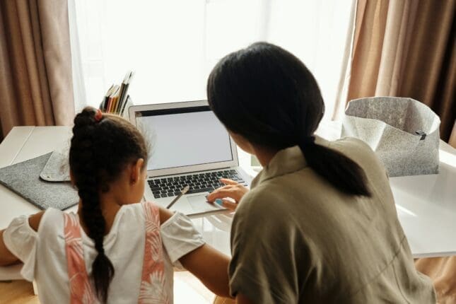 Child and Woman working on homework