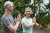 Older couple practicing yoga together | Photo by Marcus Aurelius/Pexels