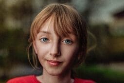 Girl In Red Crew Neck Shirt | Photo by Janko Ferlic/Pexels