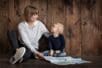 A mother and son looking at a map