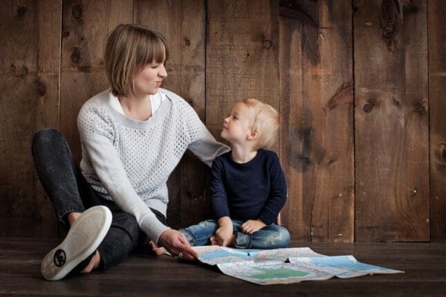 A mother and son looking at a map 