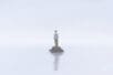 Man alone on an tiny island | ILLUSTRATION © JORM SANGSORN