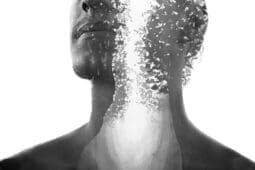 A man's head divided by light with a small boy at the base of his chest