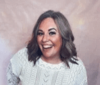 Woman smiling in white blouse