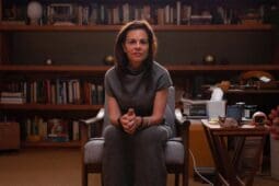 Orna Guralnik sits center frame, staring down the camera from a seat in her office