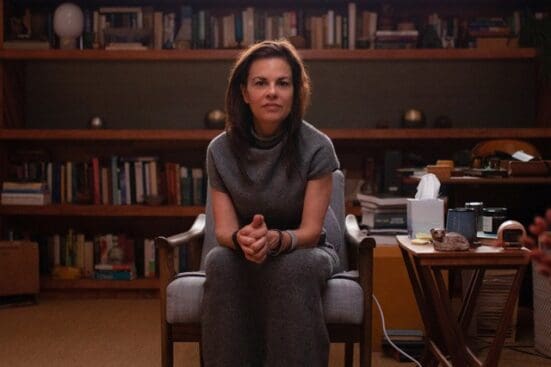 Orna Guralnik sits center frame, staring down the camera from a seat in her office