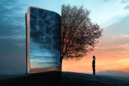 A woman stands in front of a split image of half of a tree and half of a book with a strand of DNA across it